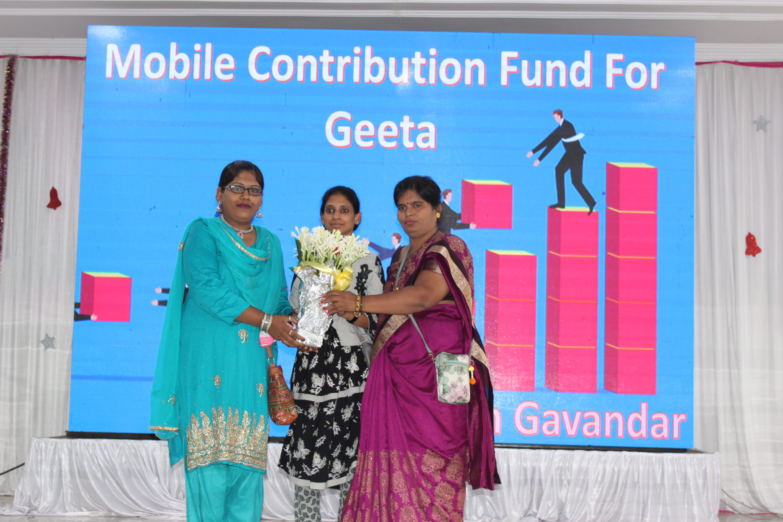 Geeta receiving support from community members
