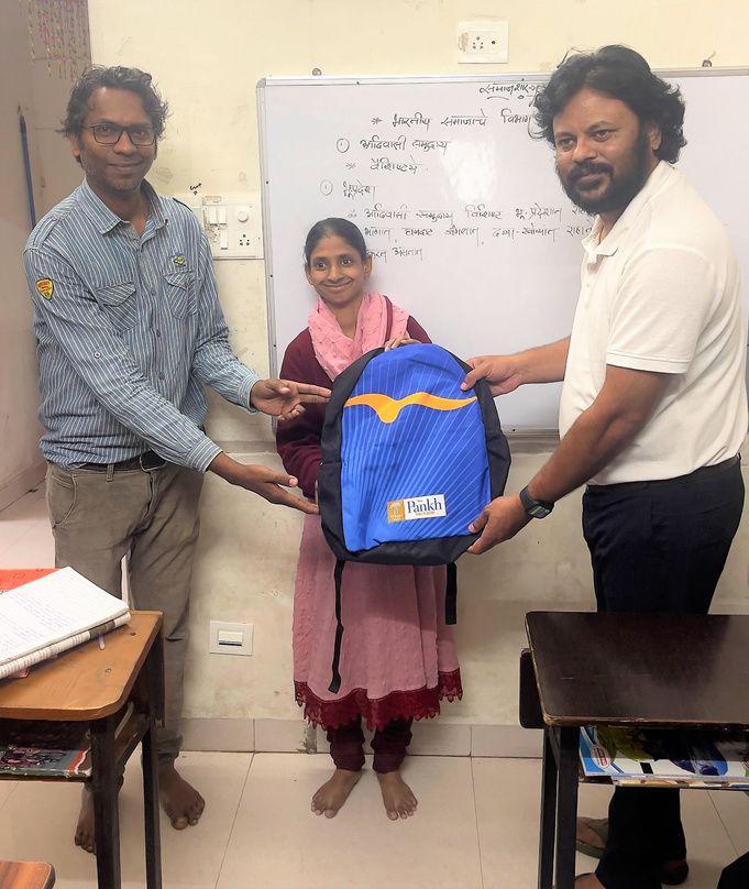 Geeta with supporters at Progressive Life Center during an education support activity